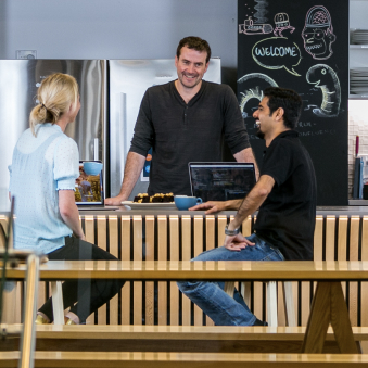 Xero employees having a conversation in a cafe