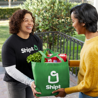 Shipt employee delivering items to a customer
